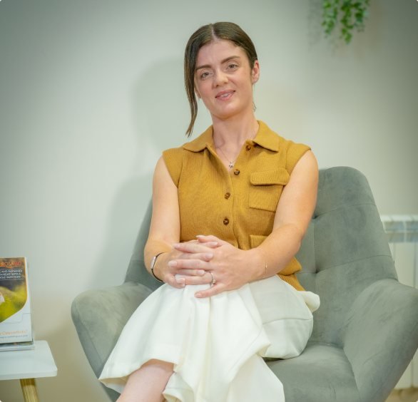 Katie Davis sitting in the clinic